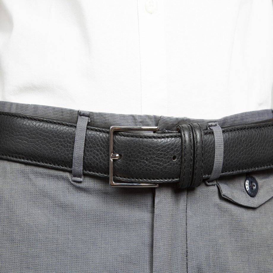 Black leather belt with silver metal buckle. Belt made by Italian artisans with top quality vegeta